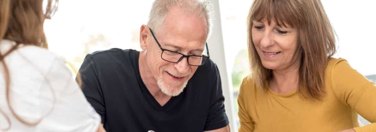 A couple signing an estate plan.