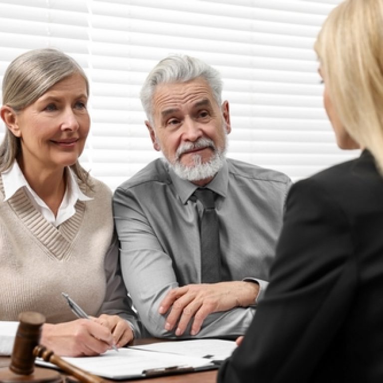 Senior,Couple,Having,Meeting,With,Lawyer,In,Office