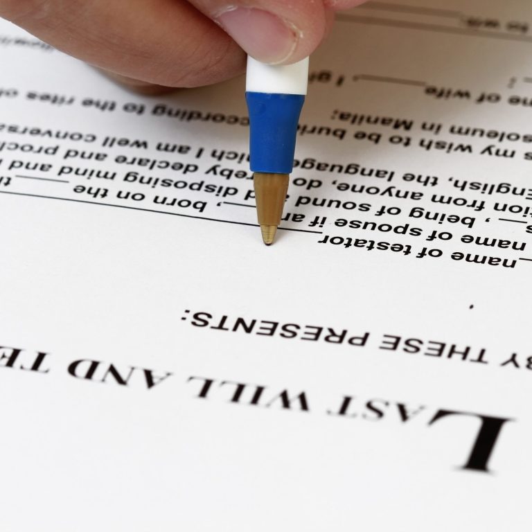 Trust and Will Attorney signing a contract