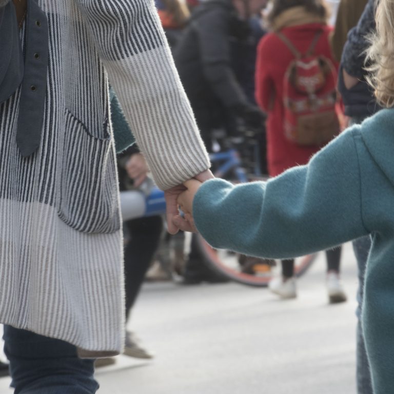 child and mother holding hands, sign of trust and intimacy